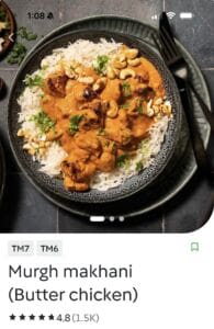 Butter chicken served with basmati rice and cashews
