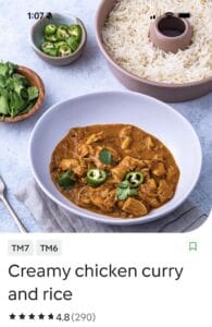 Creamy chicken curry with rice and herbs